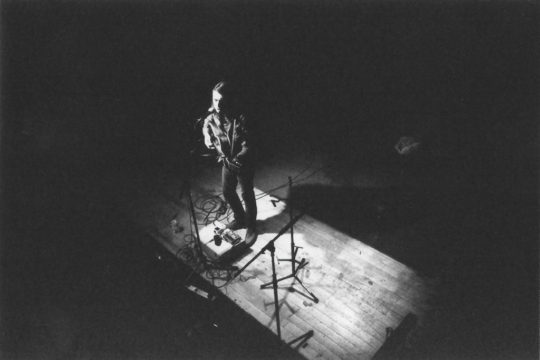 Photo of guitar player on stage